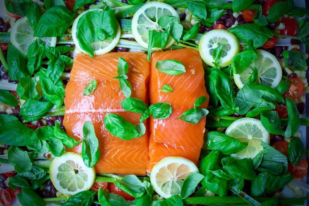 King Salmon snuggled up on a bed of veggies ready for the oven.